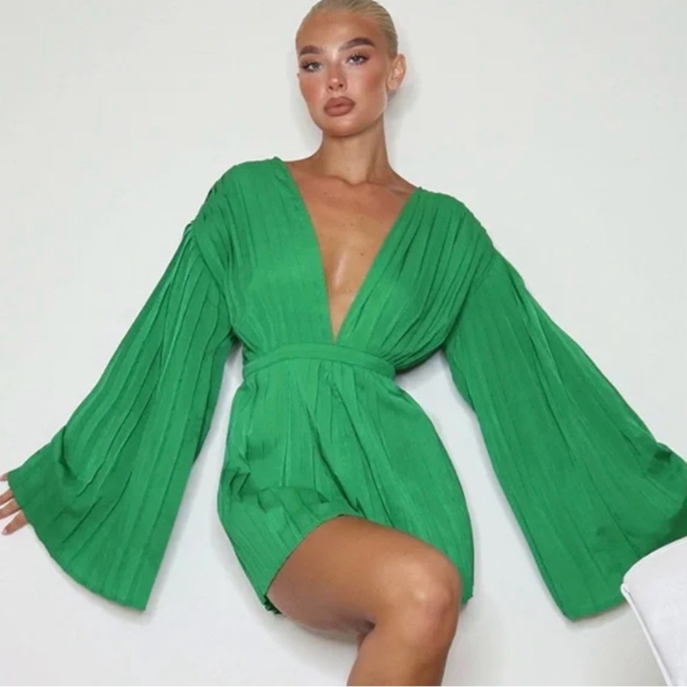 Pretty Little Thing green plunge pleated romper.